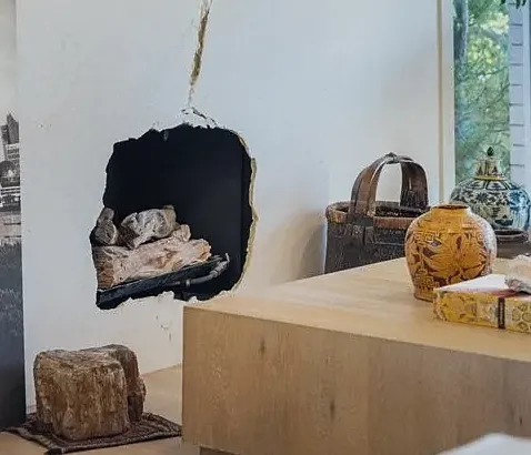 Hand-chiseled Crema Marfil firebox