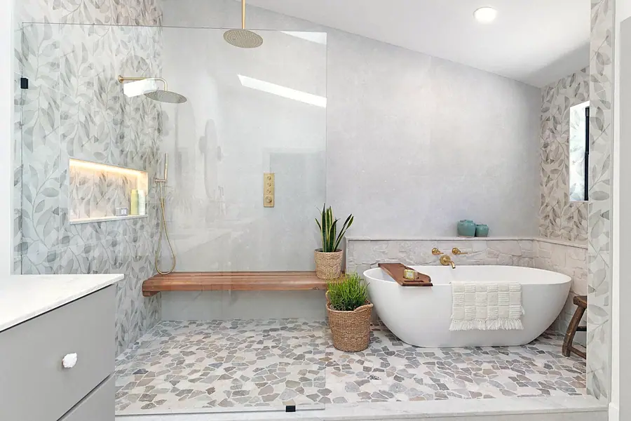 Little Gem spa bath with glass shower, freestanding tub, and pebble mosaic floor