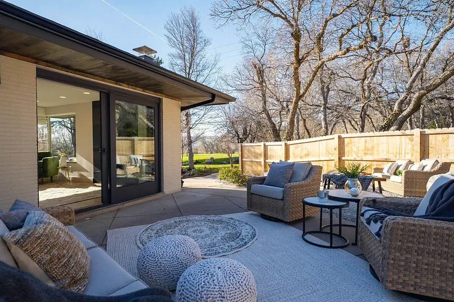 Fairway House patio lounge with wicker seating overlooking the golf course