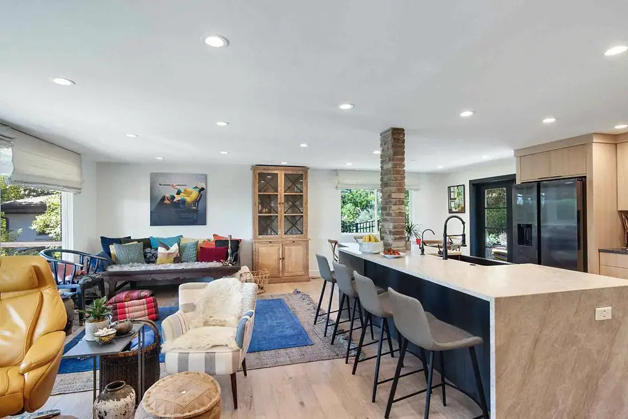 Wallace Project open living and kitchen with island seating and daybed