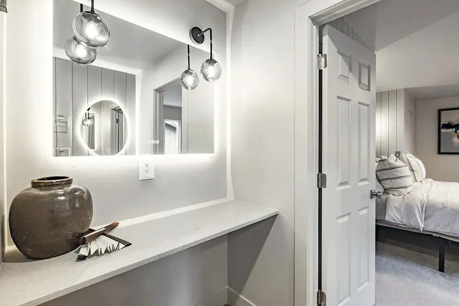 6468 S Brookstone vanity niche with backlit mirror opening to bedroom