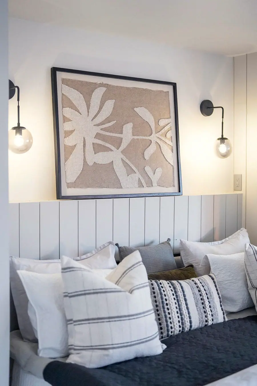 6468 S Brookstone bedroom with botanical art, wall sconces, and layered pillows