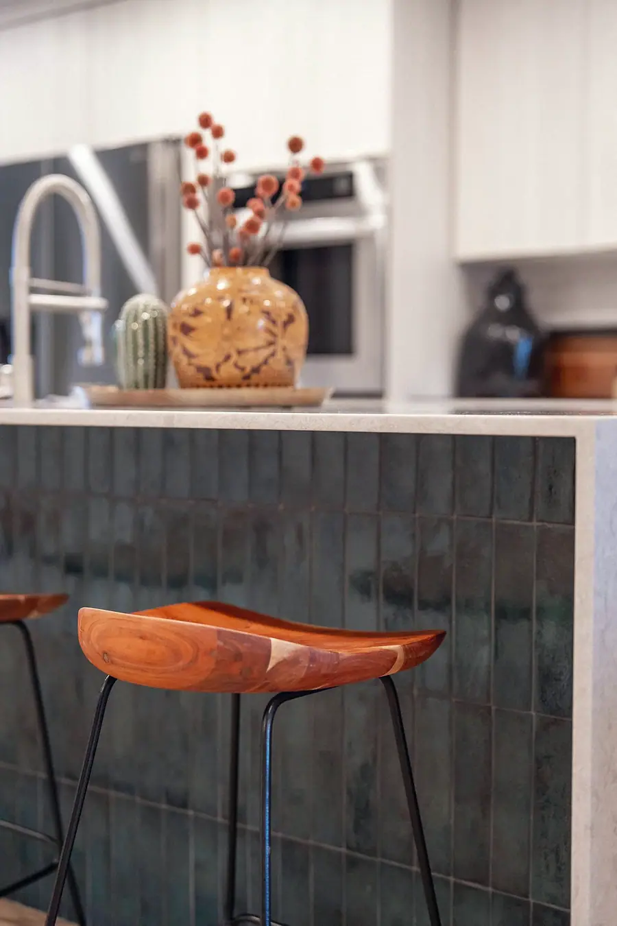 6468 S Brookstone kitchen island with teal tile and wood bar stool detail