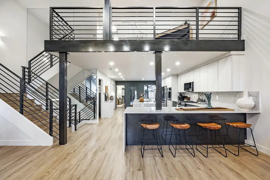 6468 S Brookstone open loft kitchen with island seating and industrial rail