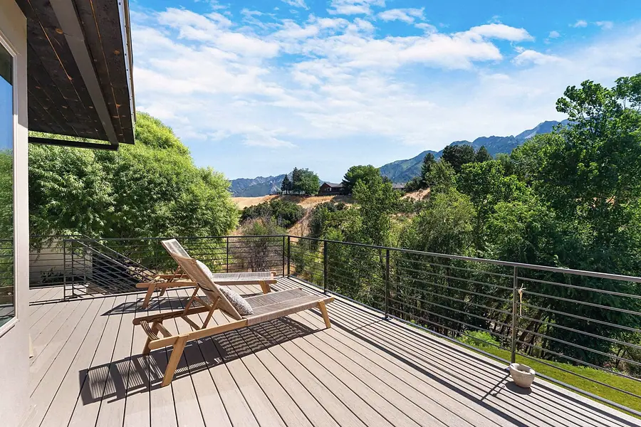 Elysium upper deck lounge chairs overlooking trees and Wasatch mountains