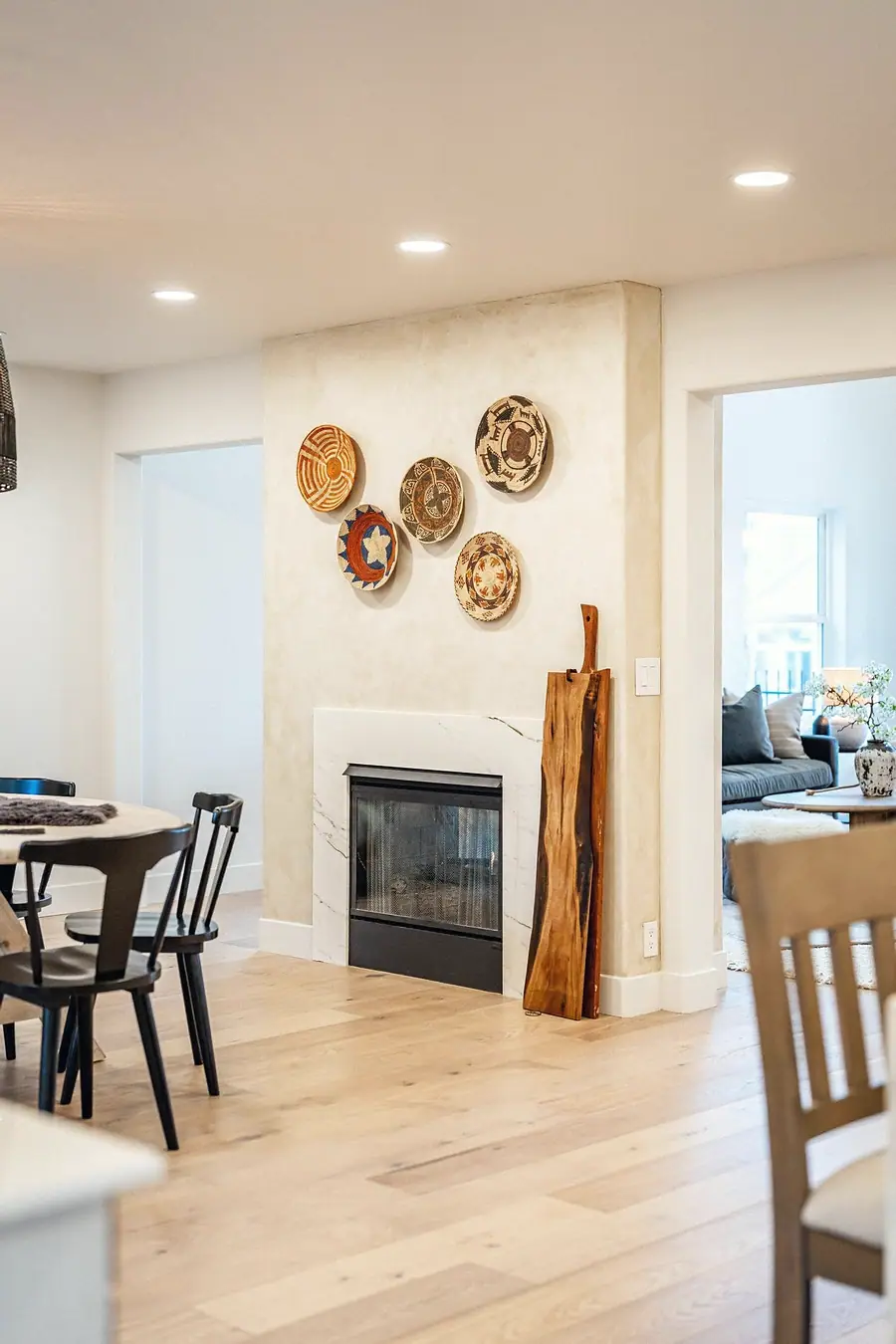 Grand Vista open dining and fireplace area with warm wood floors