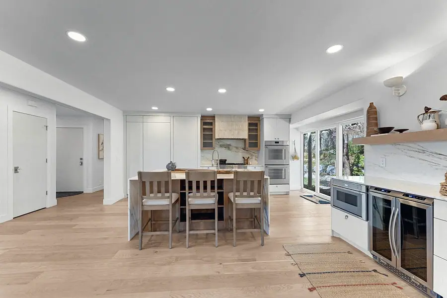 Grand Vista kitchen viewed from the dining area with island seating and appliances
