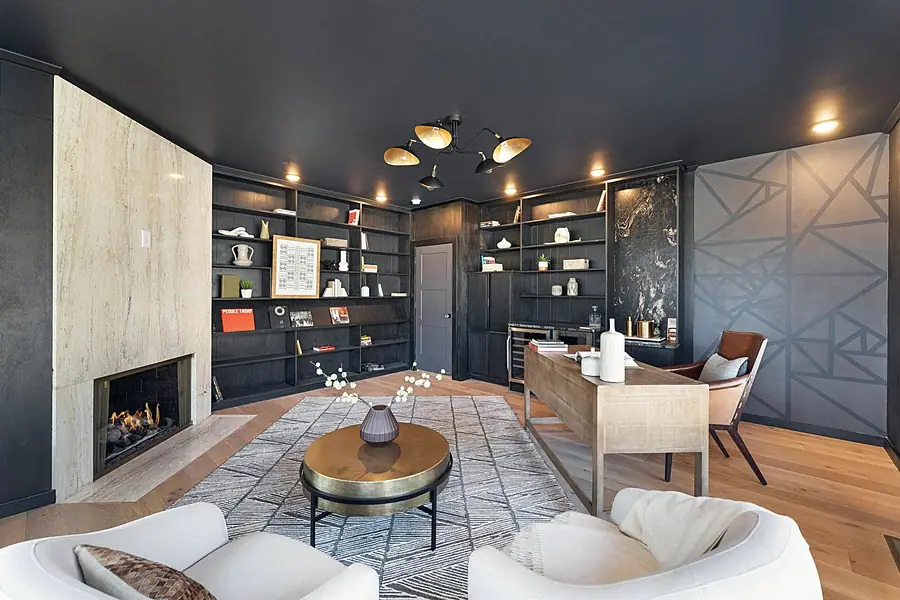 Fairway House kitchen with blush cabinetry, marble counters, and stainless refrigerator