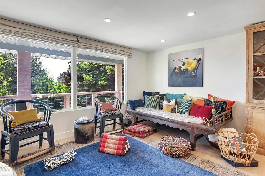 Wallace Project living room seating with colorful textiles and garden outlook